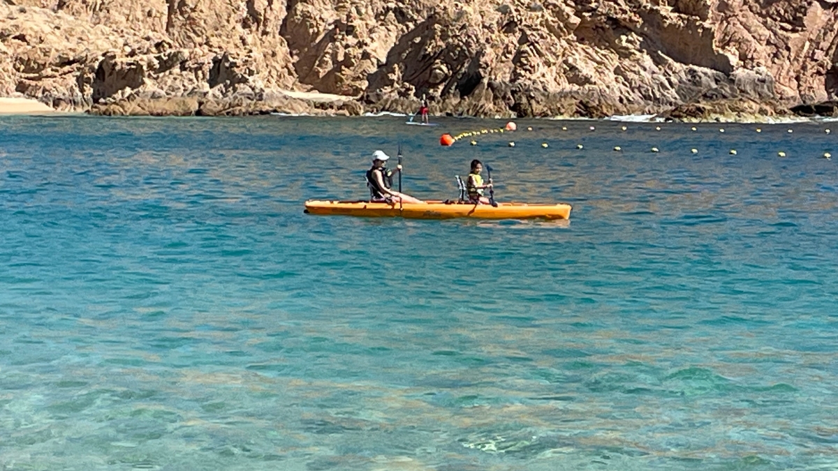 Kayaking at the calm clear water of Santa Maria Bay