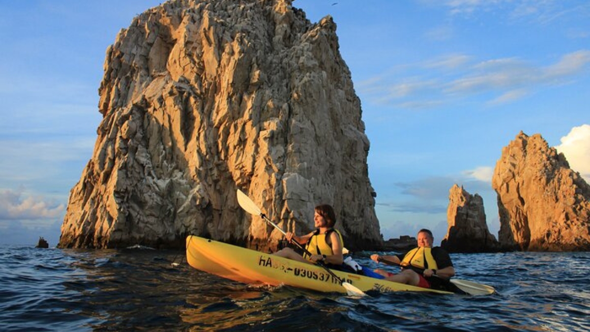 Kayakers paddling near Land's End in Cabo Bay