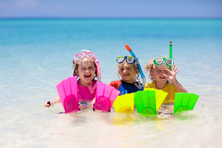 Kids wearing bright colors going to snorkel