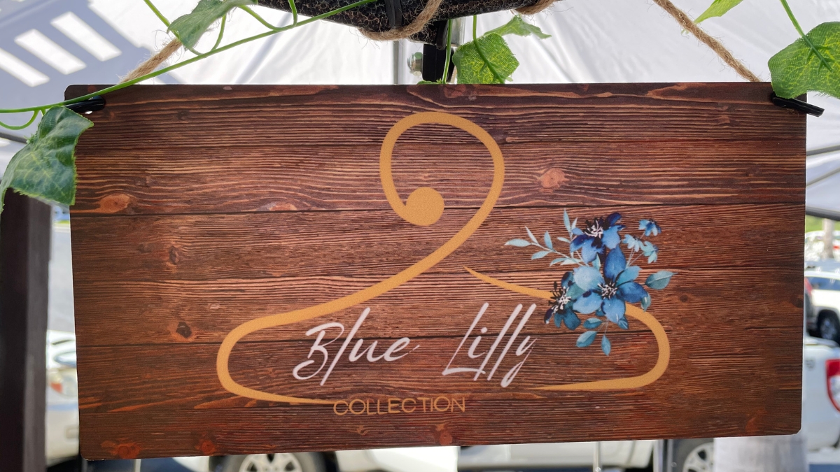 The Blue Lilly Clothing Collection market sign