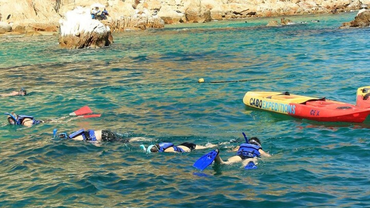 Kayaker snorkeling in Cabo Bay 