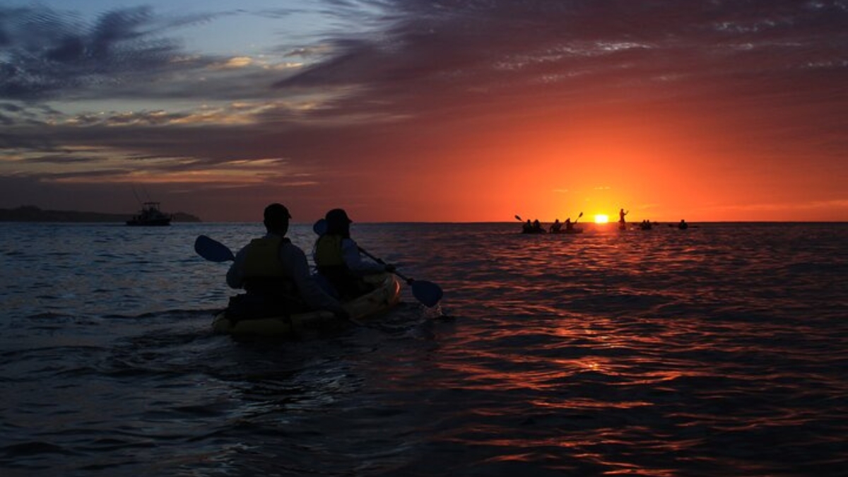 Kayaking at Cabo Bay at sunrise